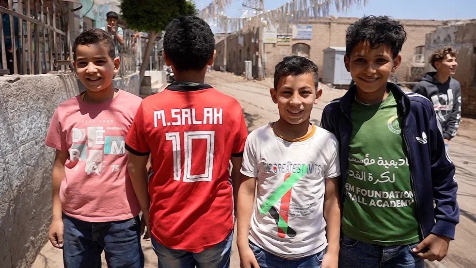 Children in Nagrig, where Liverpool and Egypt winger Mohamed Salah was born, pose for a photograph